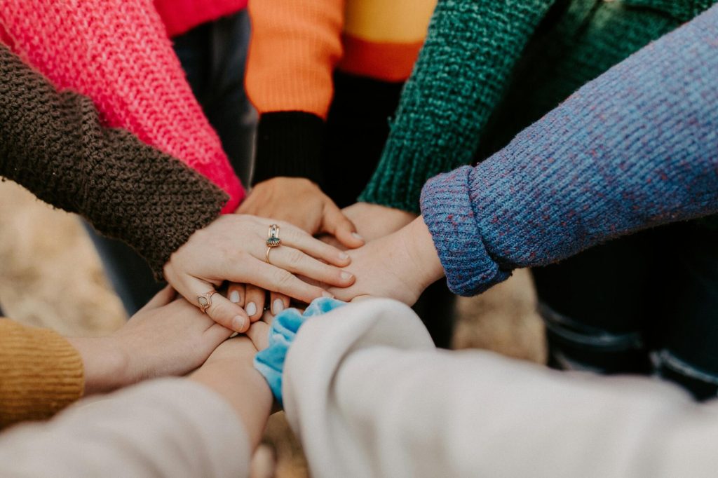 group of friends stacking hands