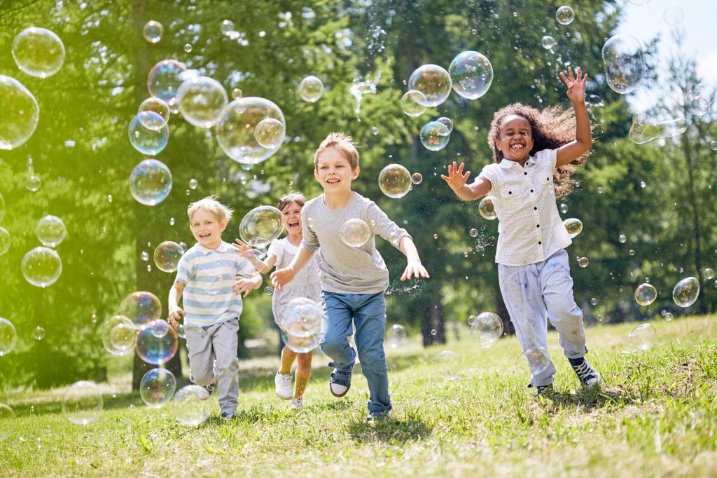 Children playing and having fun together in the spring